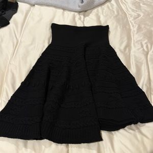 Dexterior black knit asymmetrical skirt.